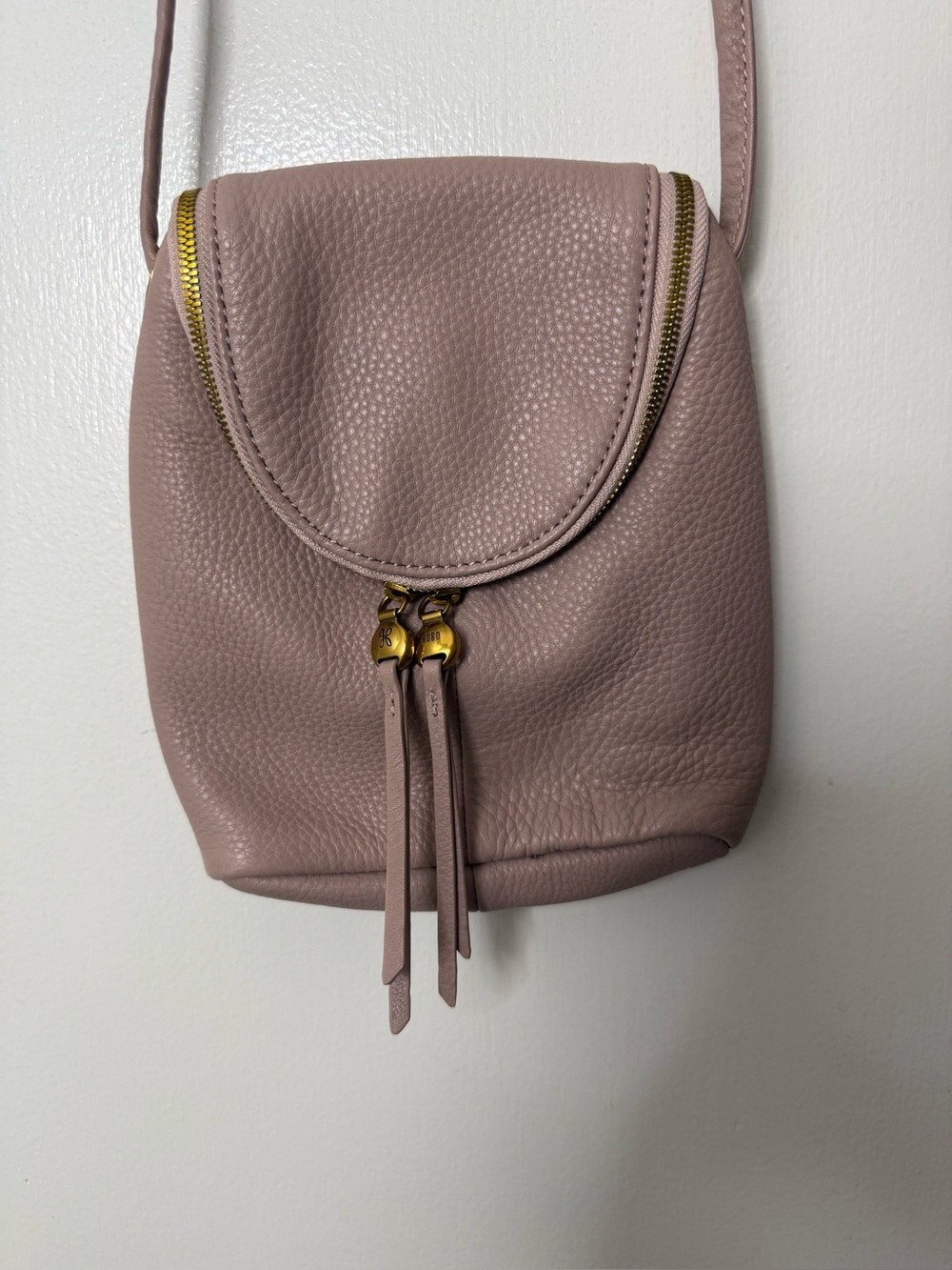 Hobo Fern small super soft leather crossbody bag in lotus pink.